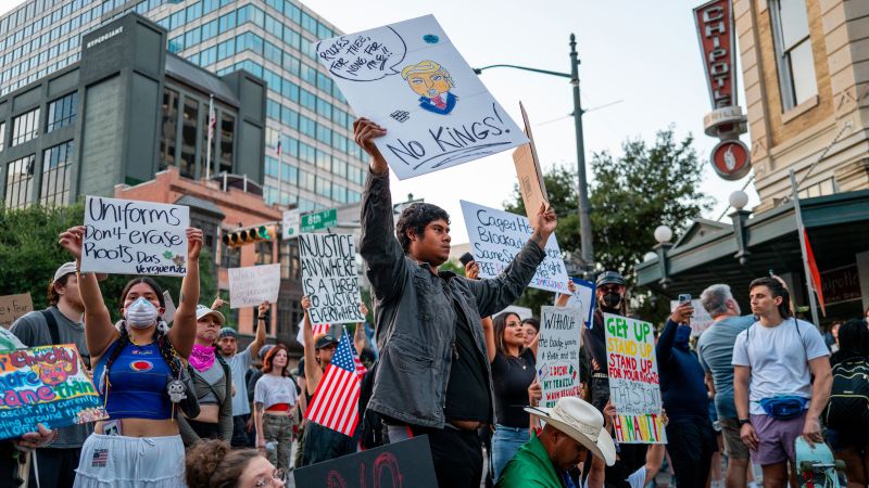 "No Kings" Events Nationwide Expected to Be Boisterous, Joyful Image ALT Text:
group of diverse people marching with democratic slogans during No Kings events nationwide